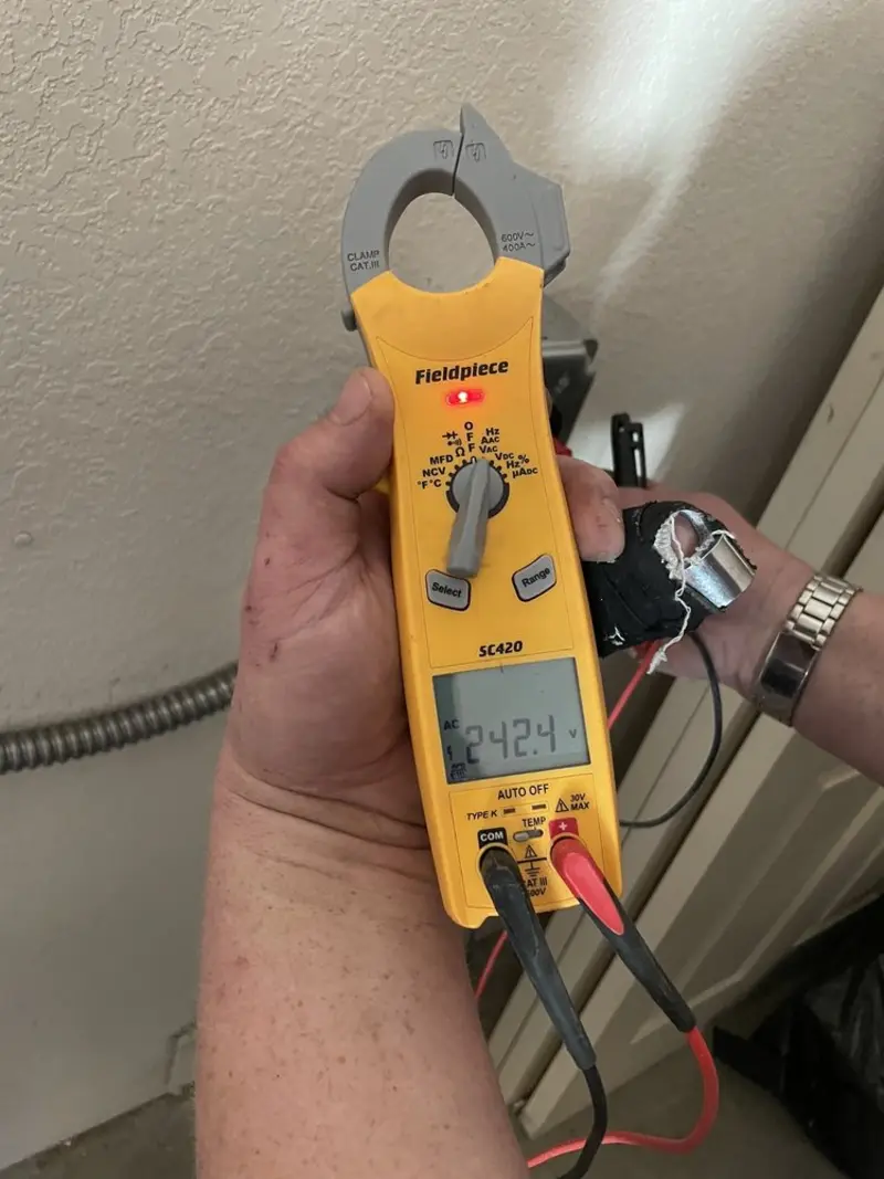 Voltage testing with clamp meter during Outlet Installation in South Hill